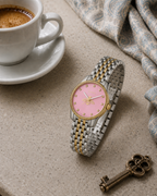 Gucci G-Timeless 29 mm Pink Bee Seconds-Hand Watch YA1265030 styled in a cafe lifestyle setting