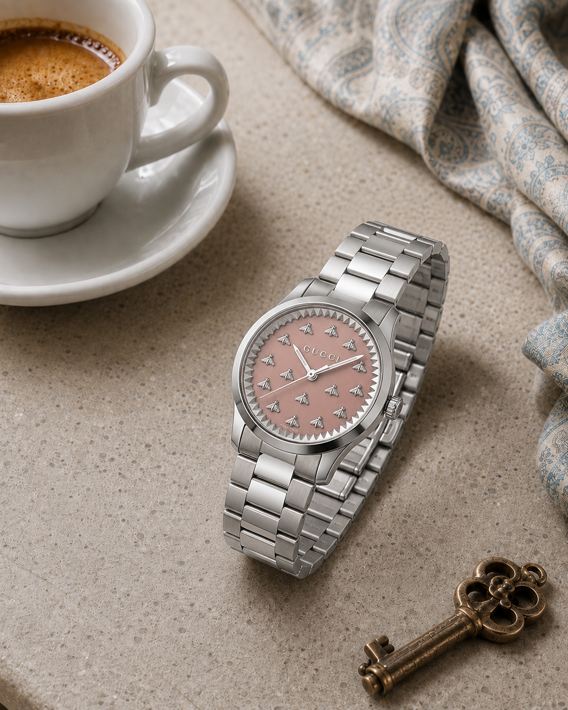 Gucci G-Timeless 32 mm Pink Bee Dial Watch YA1265033 styled in a cafe lifestyle setting