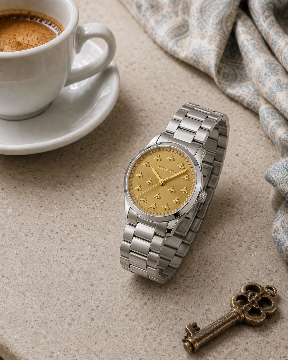 Gucci G-Timeless 32 mm Gold Bee Dial Watch YA1265035 styled in a cafe lifestyle setting