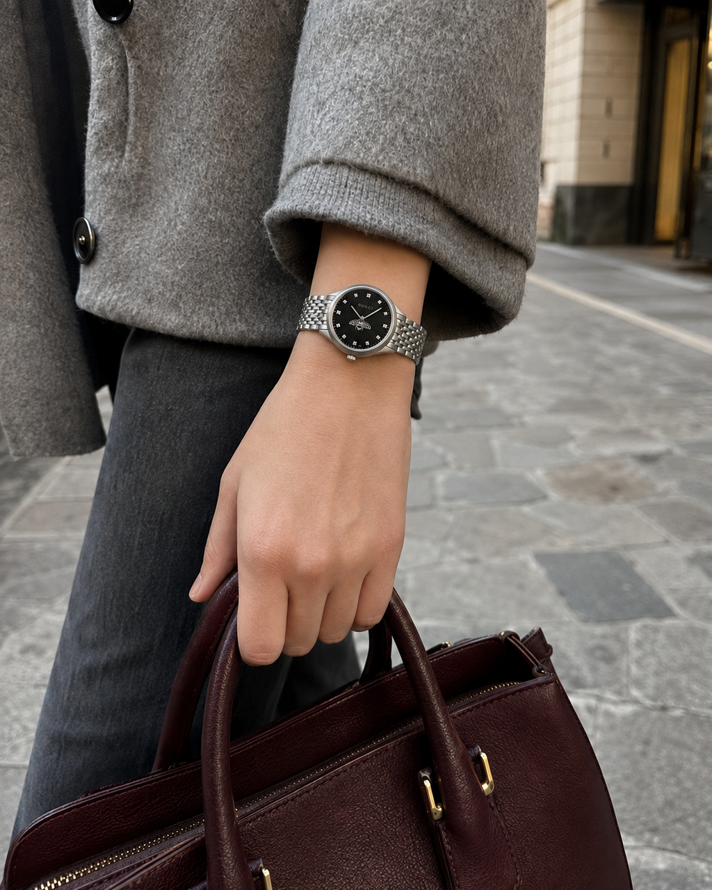 Gucci G-Timeless 29 mm Black Bee Dial Watch YA1265020 styled in a city lifestyle setting