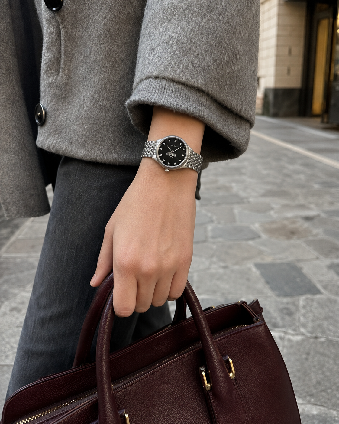Gucci G-Timeless 29 mm Black Bee Dial Watch YA1265020 styled in a city lifestyle setting