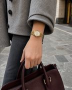 Gucci G-Timeless 29 mm Silver Bee Dial Watch YA1265021 styled in a city lifestyle setting