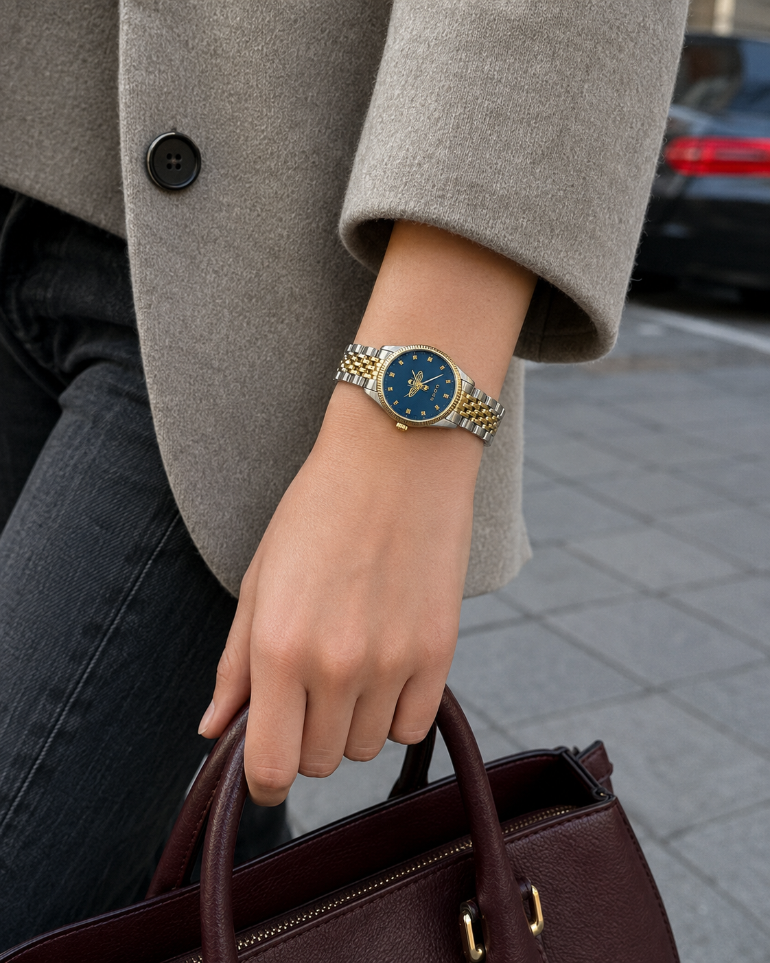 Gucci G-Timeless 29 mm Blue Bee Seconds-Hand Watch YA1265029 styled in a city lifestyle setting