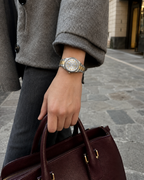 Gucci G-Timeless 32 mm Gold Bee Dial Watch YA1265032 styled in a city lifestyle setting