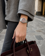 Gucci G-Timeless 32 mm Pink Bee Dial Watch YA1265033 styled in a city lifestyle setting