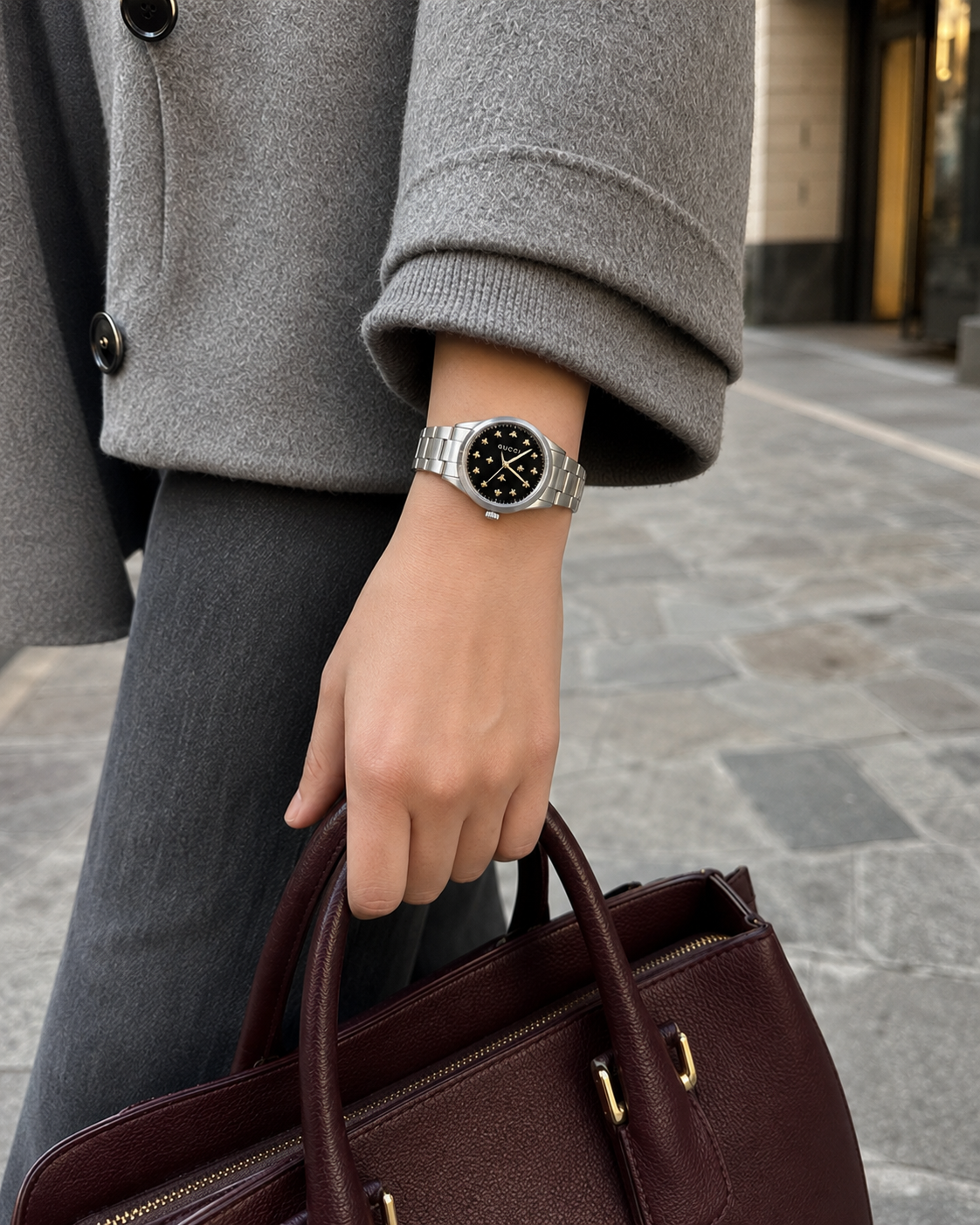 Gucci G-Timeless 32 mm Black Onyx Bee Dial Watch YA1265034 styled in a city lifestyle setting