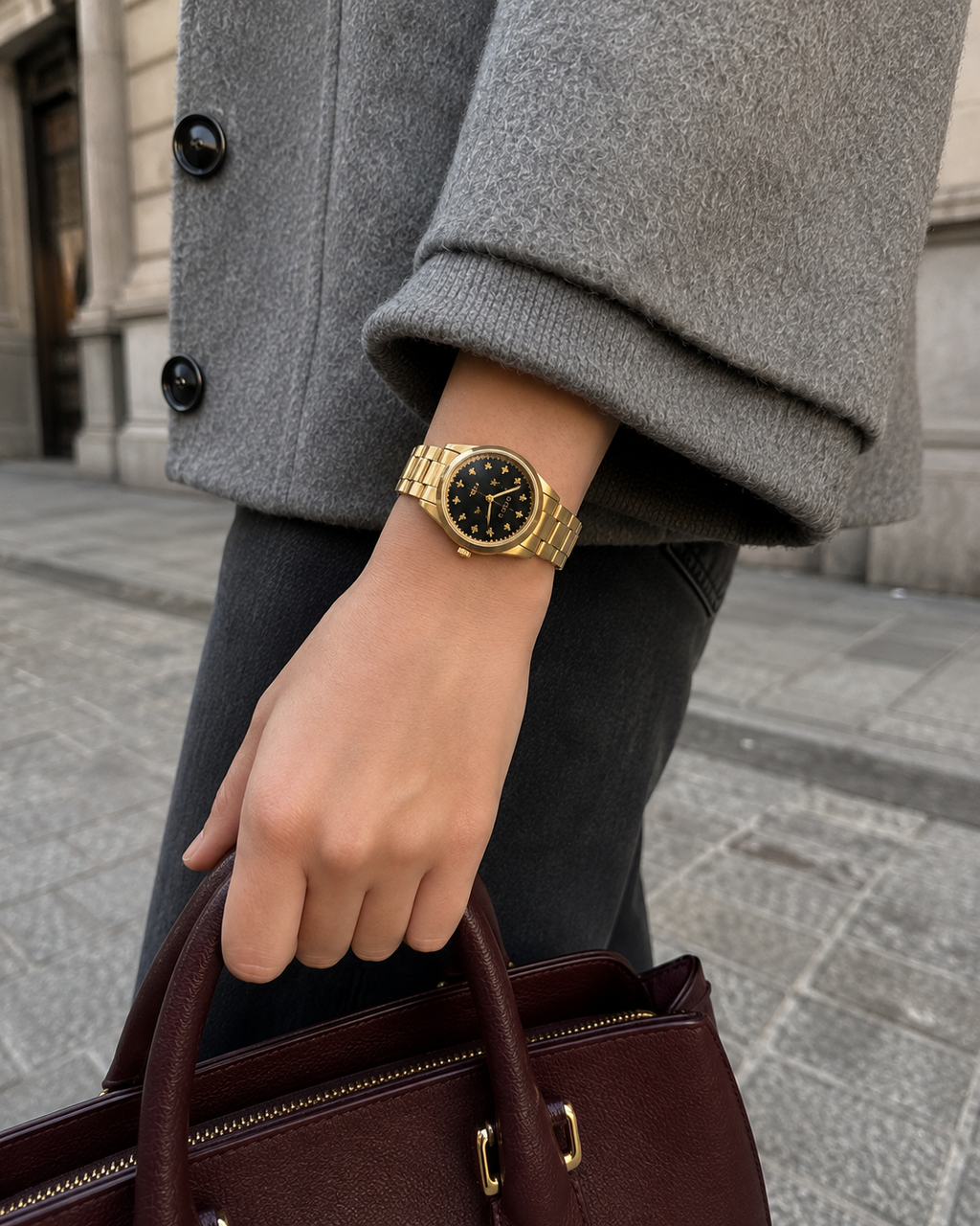 Gucci G-Timeless 32 mm Black Bee Dial Watch YA1265037 styled in a city lifestyle setting