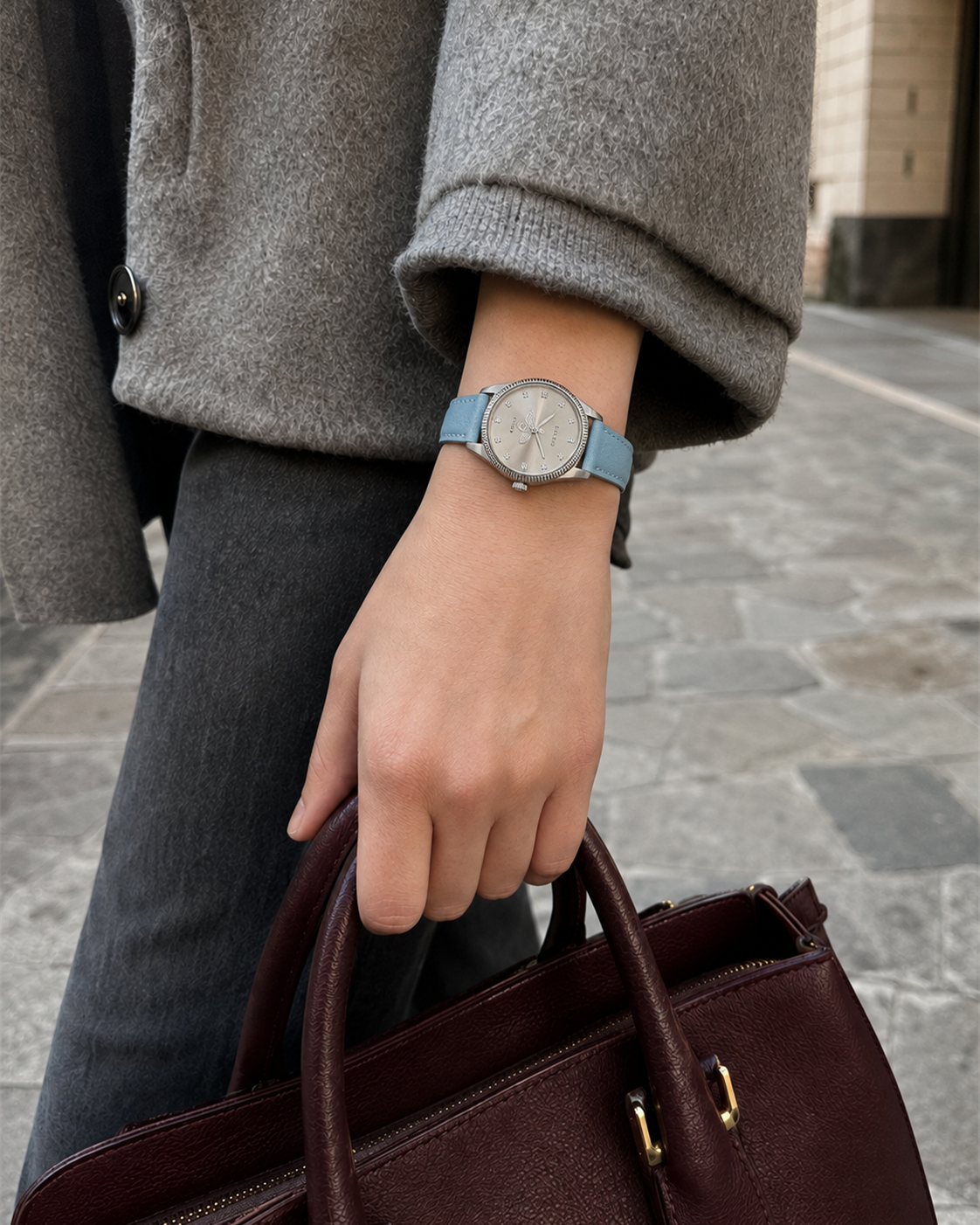 Gucci G-Timeless 29 mm Silver Bee Dial Watch YA1265039 styled in a city lifestyle setting