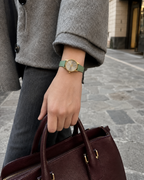 Gucci G-Timeless 29 mm Gold Bee Dial Watch YA1265040 styled in a city lifestyle setting