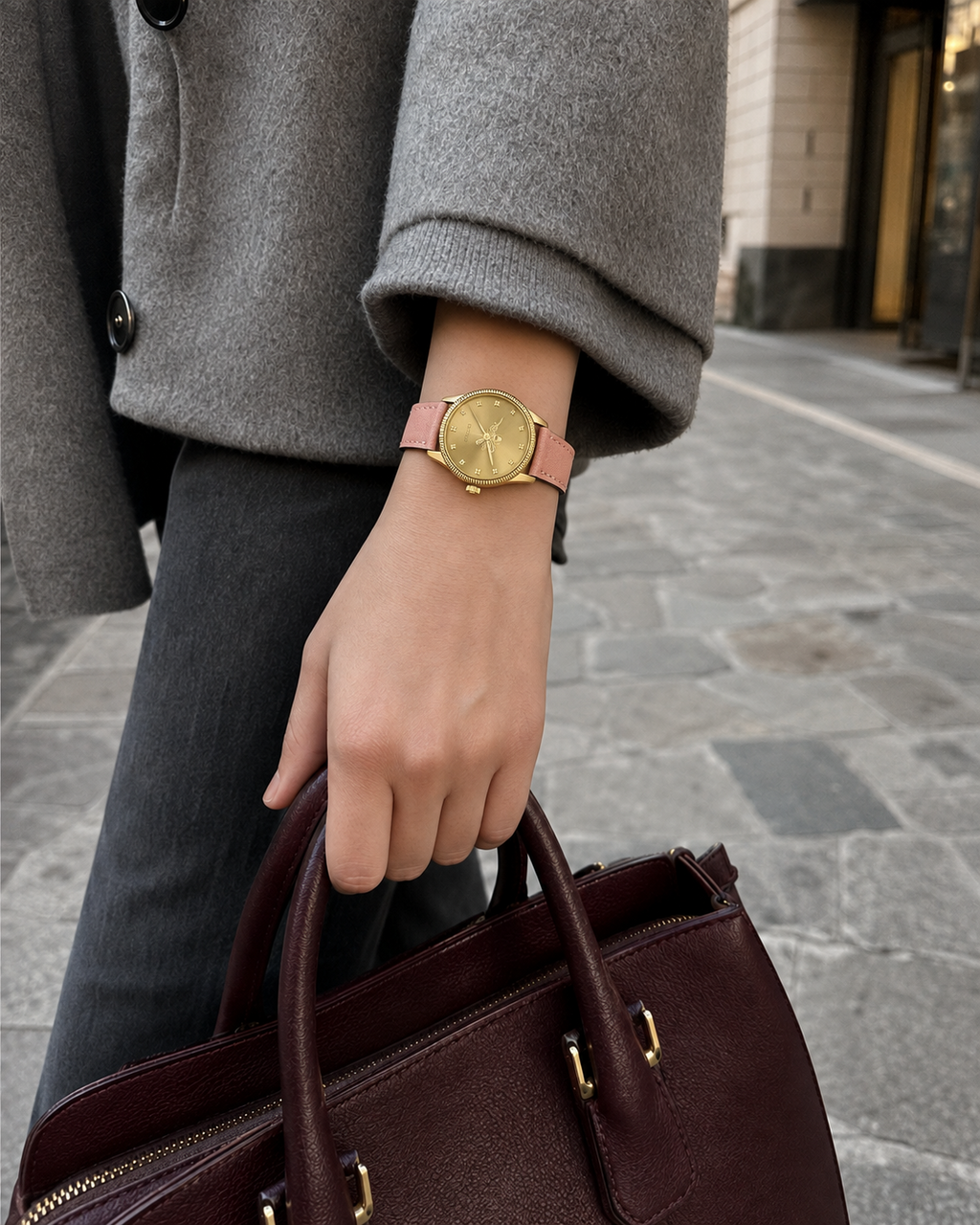 Gucci G-Timeless 29 mm Gold Bee Dial Watch YA1265041 styled in a city lifestyle setting
