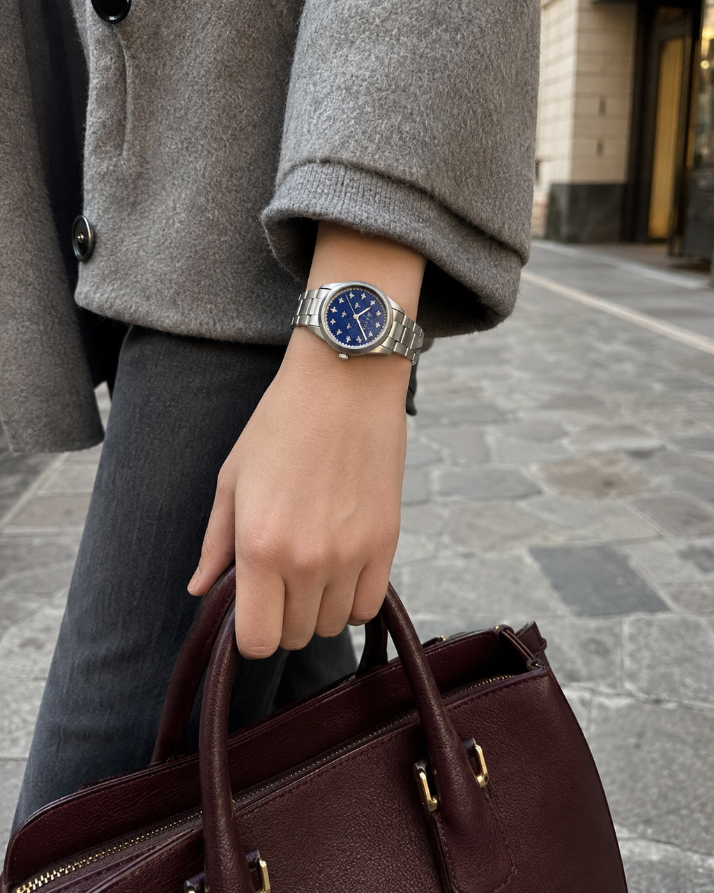 Gucci G-Timeless 32 mm Blue Lapis Bee Dial Watch YA1265043 styled in a city lifestyle setting