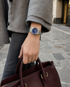 Gucci G-Timeless 32 mm Blue Lapis Bee Dial Watch YA1265043 styled in a city lifestyle setting