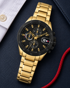 Tommy Hilfiger Jameson Men's Dual-Time Multifunction Watch – Black Dial, Gold Steel Bracelet, 43mm – 1792199 – luxury flat lay