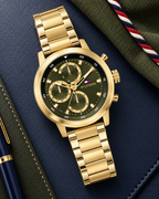 Tommy Hilfiger Rocky Men's Multifunction Watch – Green Dial, Gold Steel Bracelet, 46mm – 1792216 – luxury flat lay