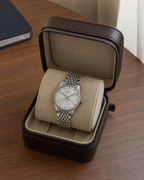 Gucci G-Timeless 29 mm Silver Bee Dial Watch YA1265019 presented in a luxury travel flat lay