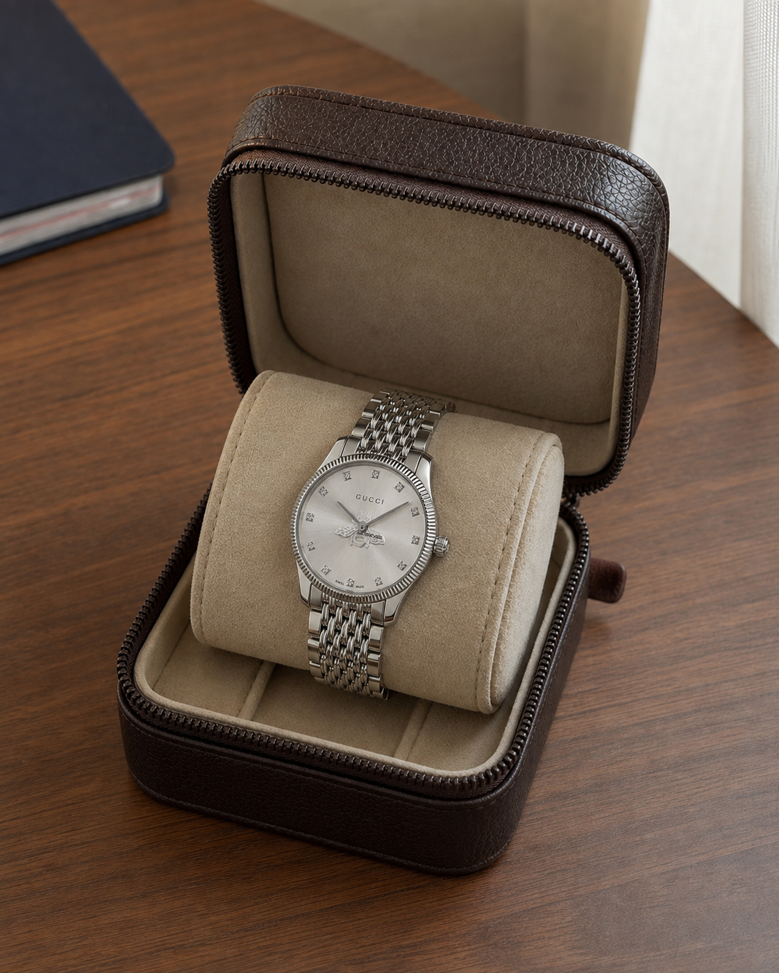 Gucci G-Timeless 29 mm Silver Bee Dial Watch YA1265019 presented in a luxury travel flat lay