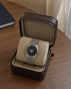Gucci G-Timeless 29 mm Black Bee Dial Watch YA1265020 presented in a luxury travel flat lay
