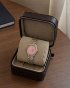 Gucci G-Timeless 29 mm Pink Bee Seconds-Hand Watch YA1265030 presented in a luxury travel flat lay