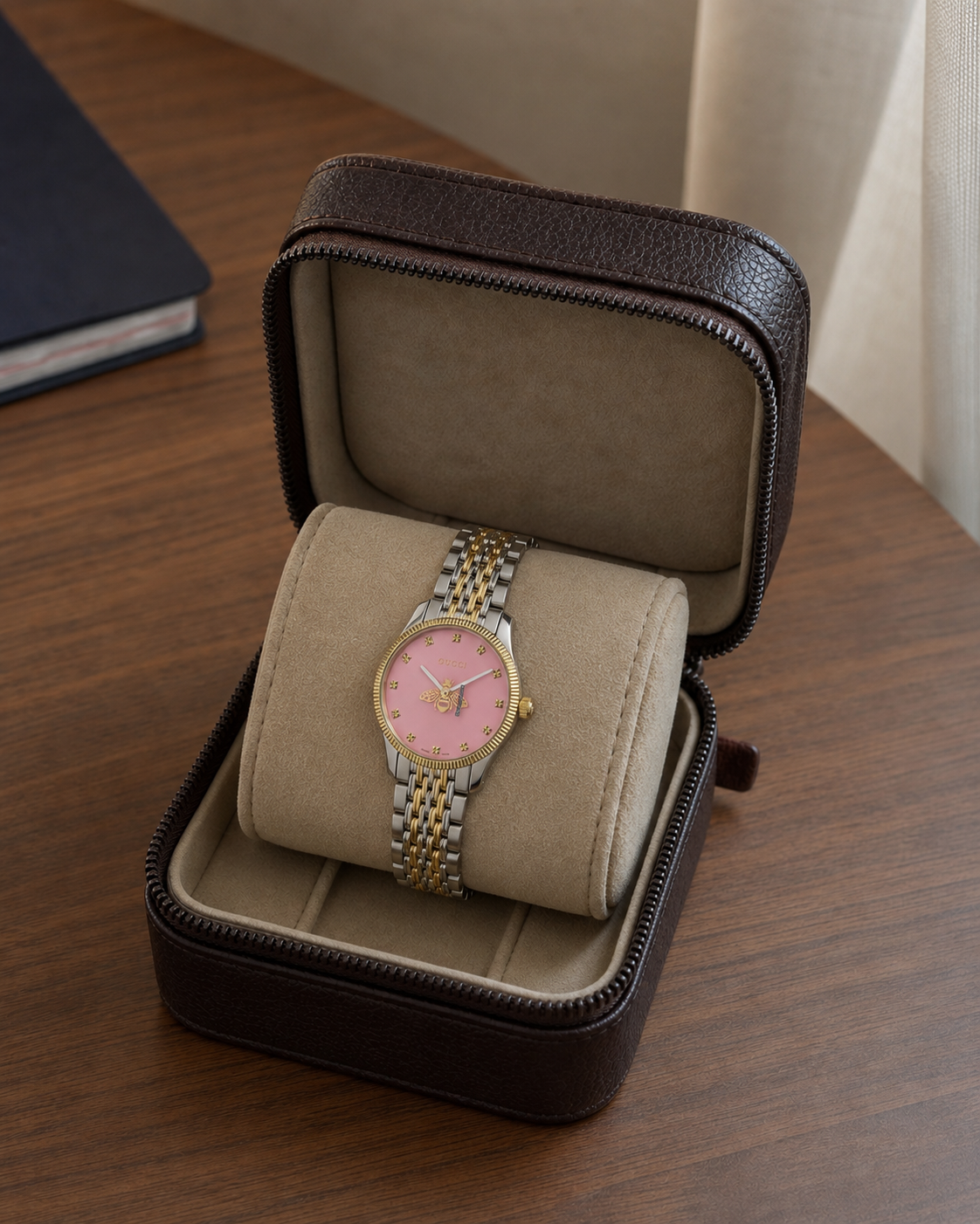 Gucci G-Timeless 29 mm Pink Bee Seconds-Hand Watch YA1265030 presented in a luxury travel flat lay