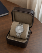 Gucci G-Timeless 32 mm Silver Bee Dial Watch YA1265031 presented in a luxury travel flat lay