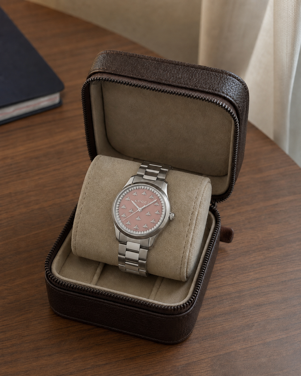 Gucci G-Timeless 32 mm Pink Bee Dial Watch YA1265033 presented in a luxury travel flat lay