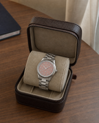 Gucci G-Timeless 32 mm Pink Bee Dial Watch YA1265033 presented in a luxury travel flat lay