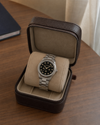 Gucci G-Timeless 32 mm Black Onyx Bee Dial Watch YA1265034 presented in a luxury travel flat lay