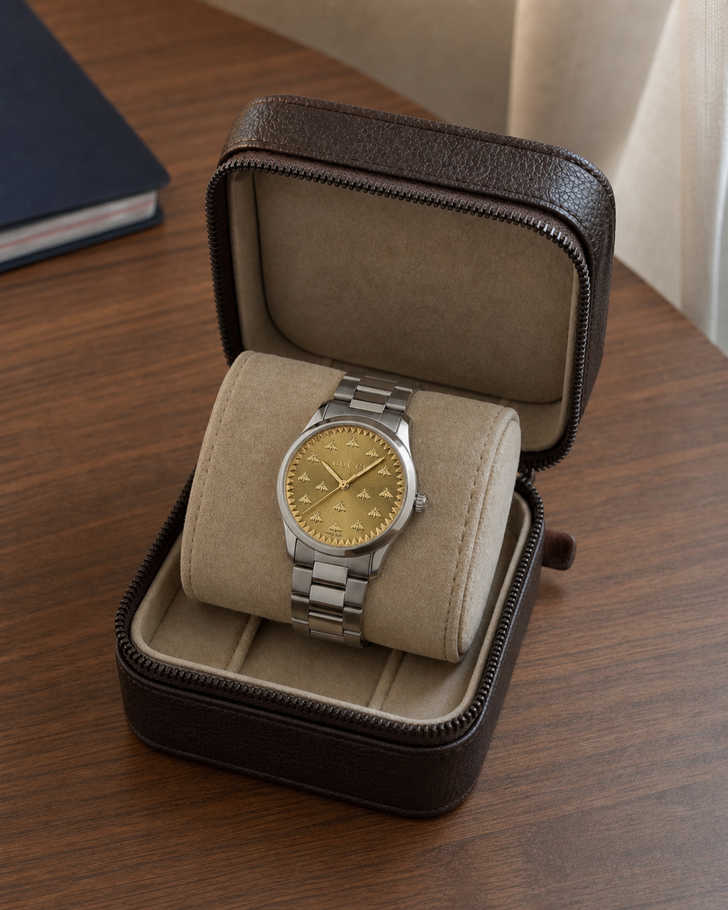 Gucci G-Timeless 32 mm Gold Bee Dial Watch YA1265035 presented in a luxury travel flat lay