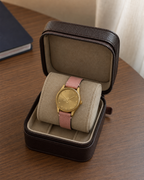 Gucci G-Timeless 29 mm Gold Bee Dial Watch YA1265041 presented in a luxury travel flat lay