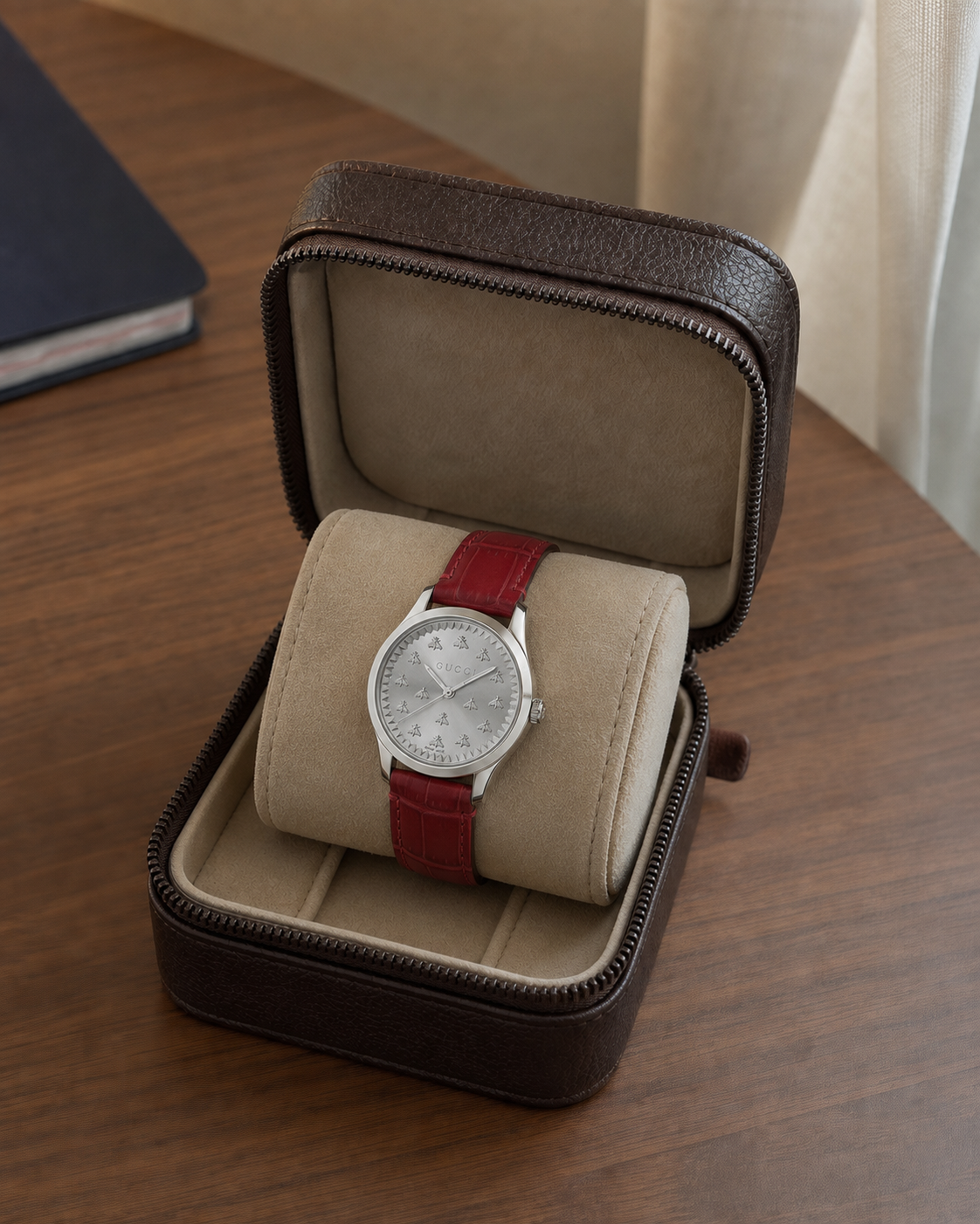 Gucci G-Timeless 32 mm Silver Bee Dial Watch YA1265057 presented in a luxury travel flat lay