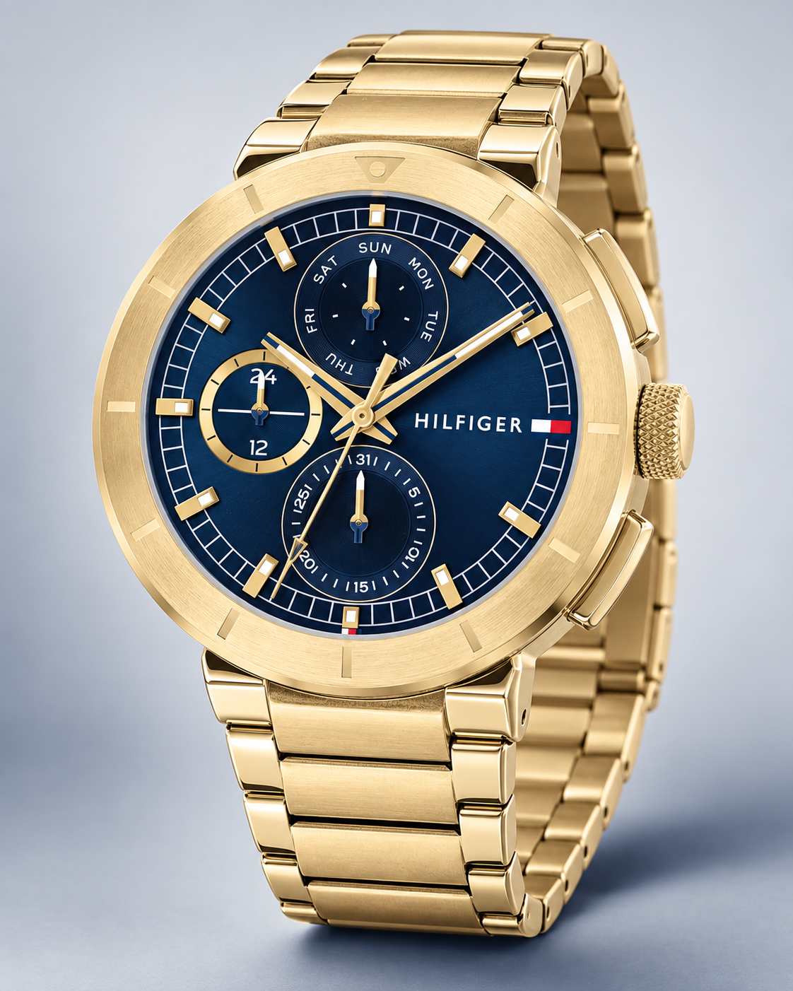 Tommy Hilfiger Lorenzo Men's Multifunction Watch – Navy Dial, Gold Steel Bracelet, 44mm – 1792118 – three-quarter profile