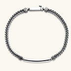 Silver stainless steel men's bracelet with braided foxtail chain, Greek key engraved bar, and decorative cube connectors.