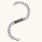 Silver 316L stainless steel curb chain bracelet with black Greek key meander rectangular ID plate, adjustable lobster clasp.