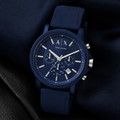 Armani Exchange AX1327 men's watch on dark fabric