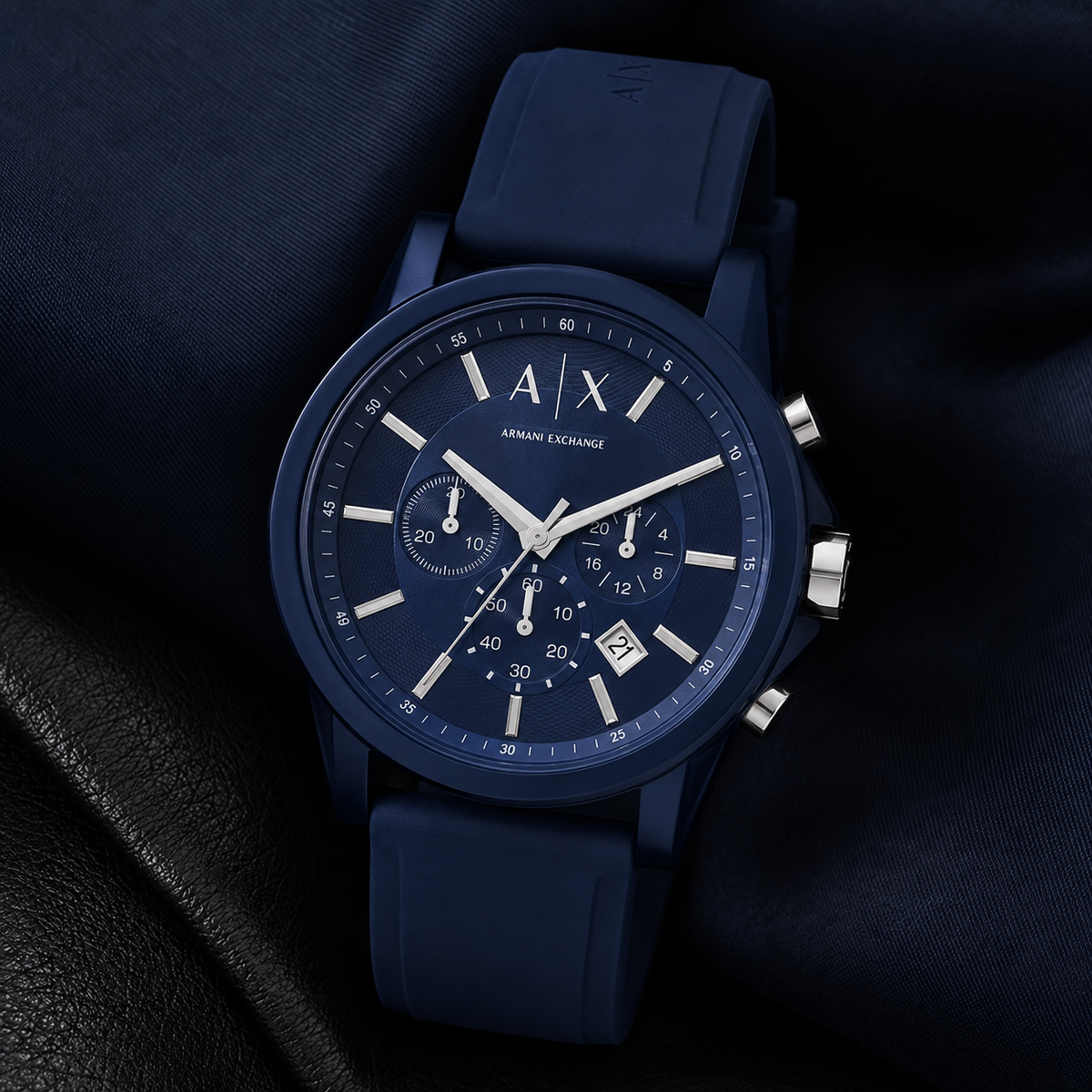 Armani Exchange AX1327 men's watch on dark fabric