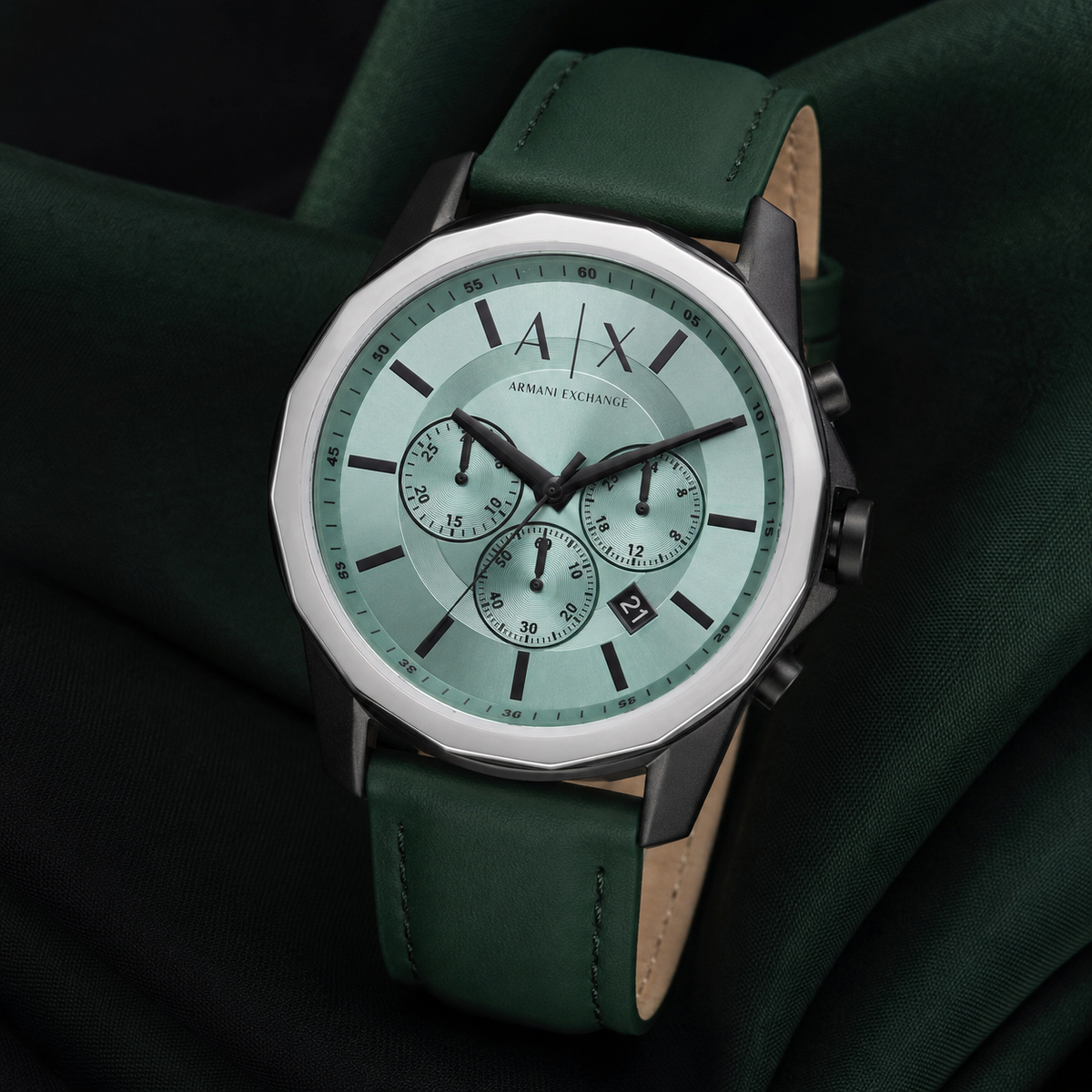 Armani Exchange AX1725 men's watch on dark green fabric