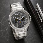 Armani Exchange AX1736 men's marble dial multifunction watch desk scene
