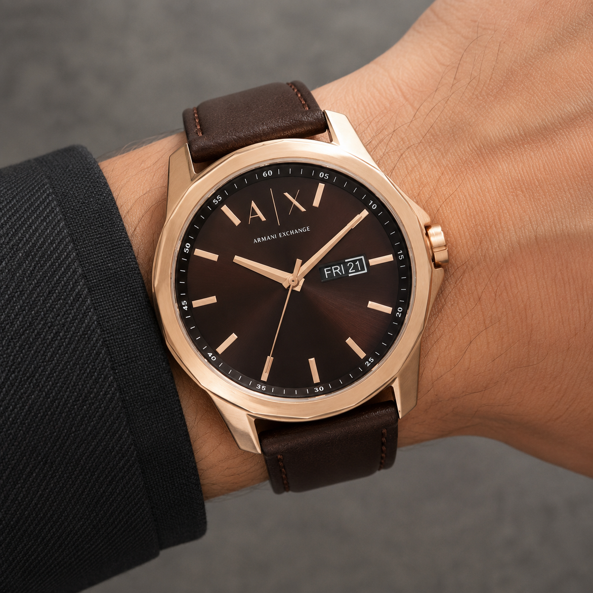 Armani Exchange AX1740 rose-gold brown day-date watch worn on inner wrist