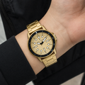 AX1854 men's gold-tone dive-style watch worn on the inner wrist