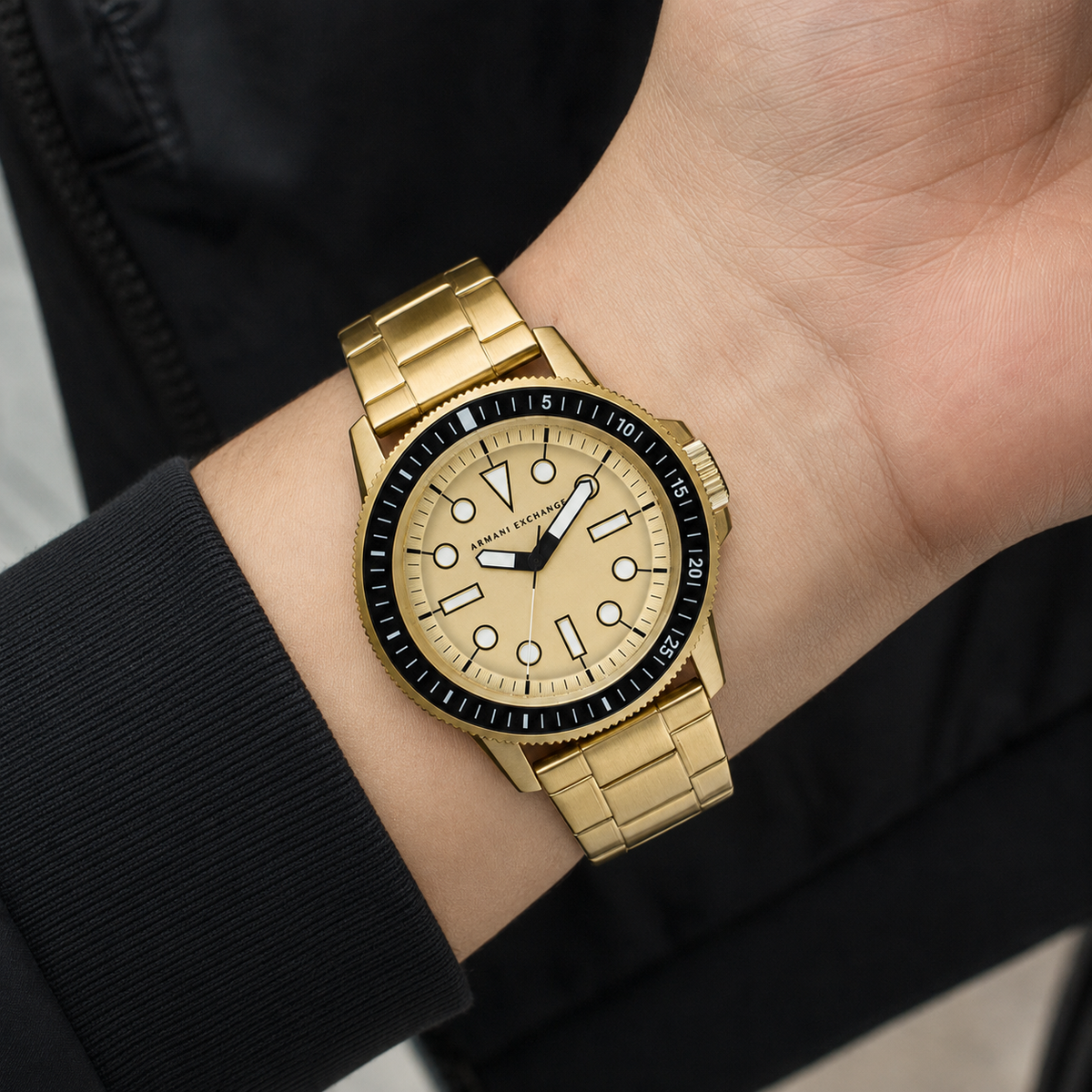 AX1854 men's gold-tone dive-style watch worn on the inner wrist