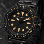 AX1855 men's black and gold dive-style watch dial macro detail