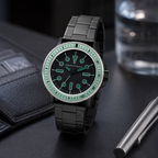 AX1858 men's black and mint dive-style watch modern desk lifestyle view
