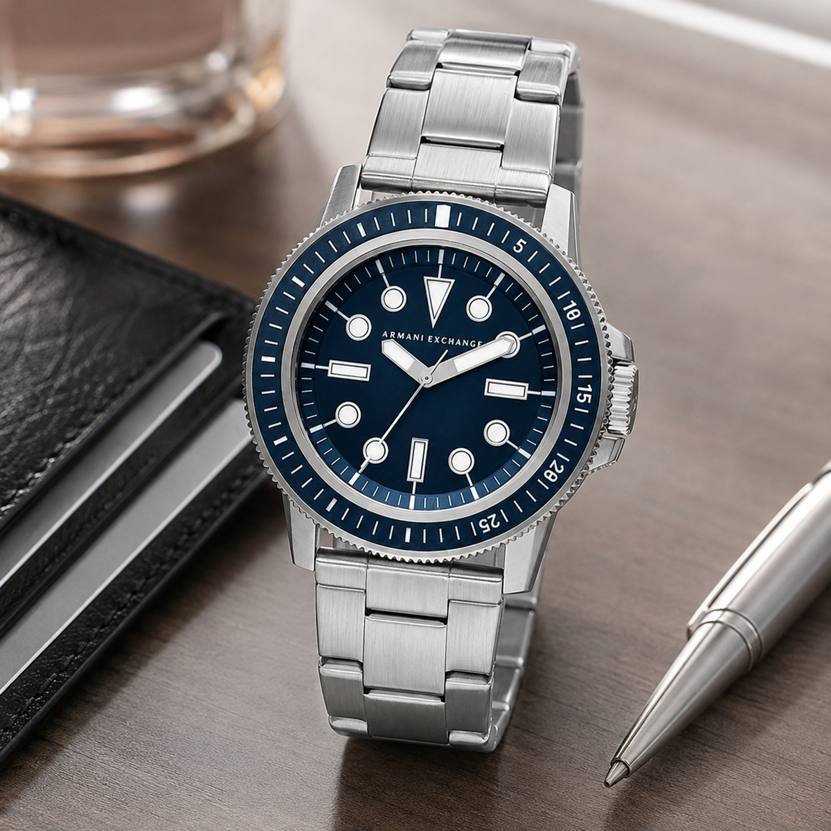AX1861 men's silver and navy dive-style watch desk lifestyle view