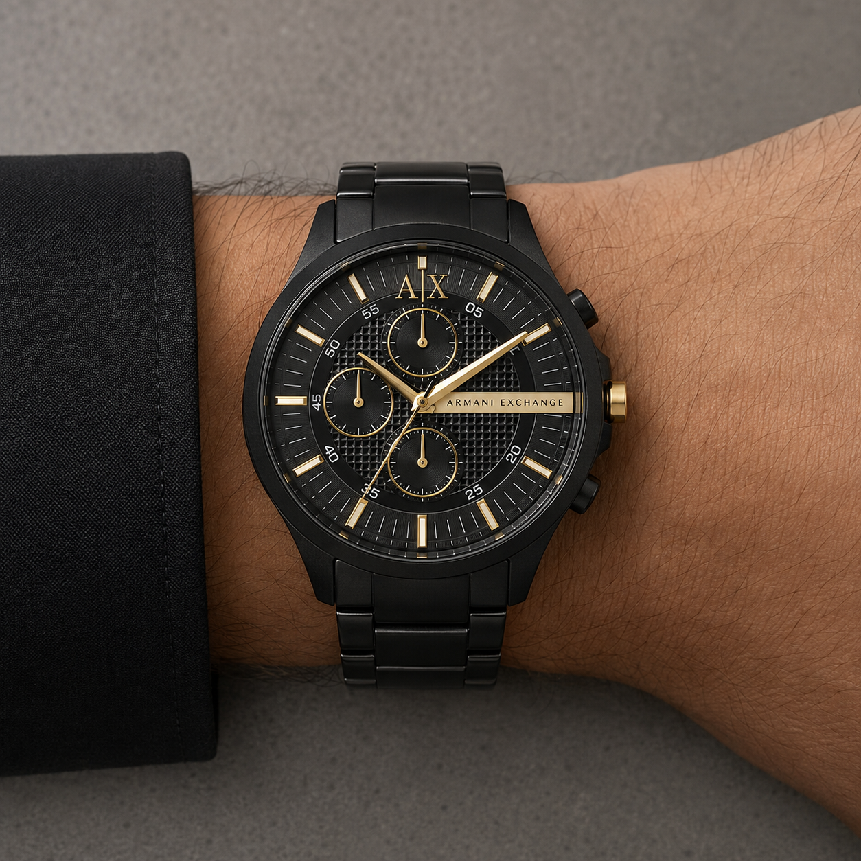 Armani Exchange AX2133 men's black and gold-tone chronograph watch on wrist