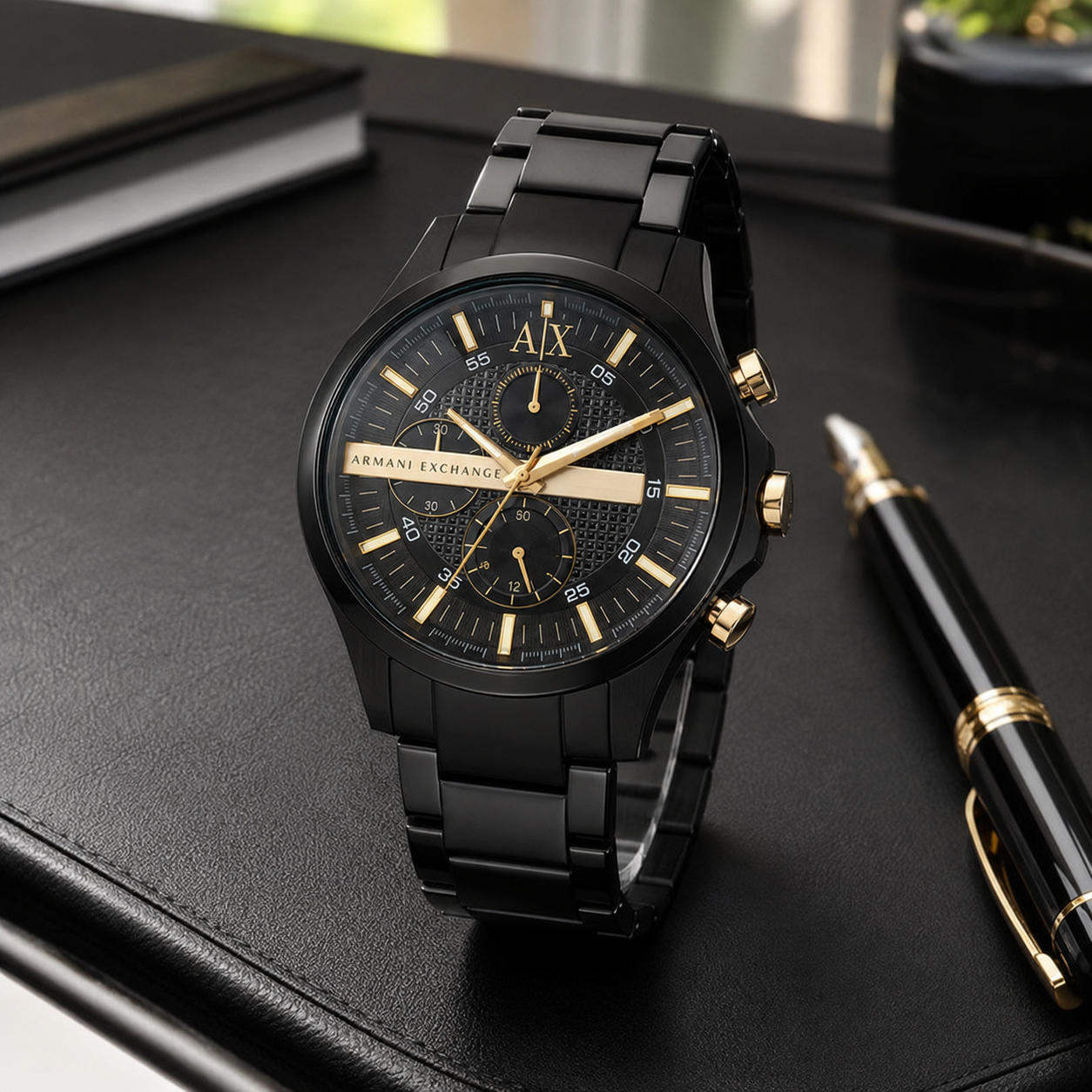 Armani Exchange AX2133 black and gold-tone chronograph desk view