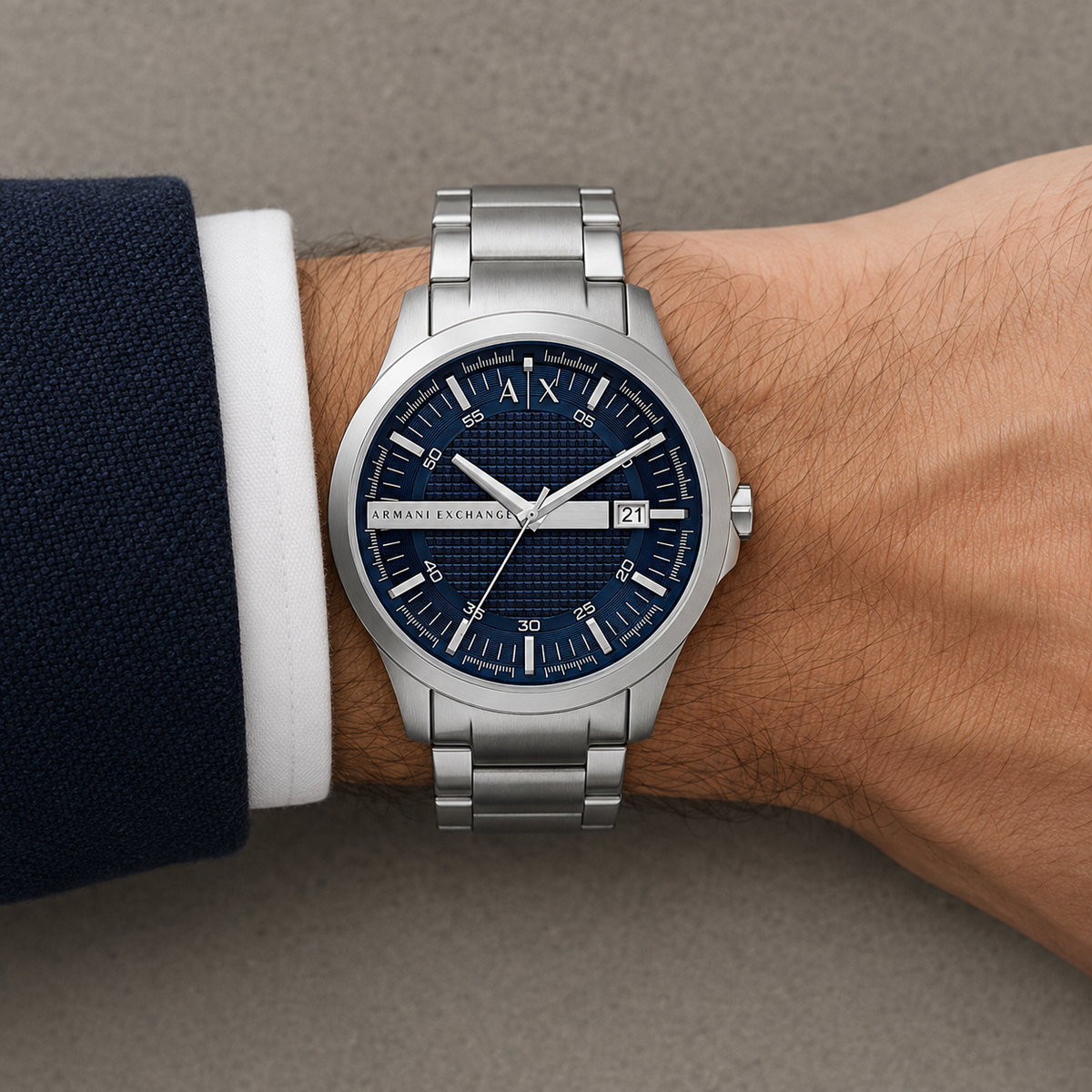 Armani Exchange AX2137 men's silver watch with navy dial on wrist