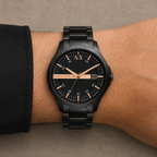 Armani Exchange AX2152 men's black and rose-gold-tone watch on wrist