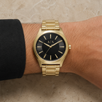 Armani Exchange AX2328 men's gold-tone watch on wrist