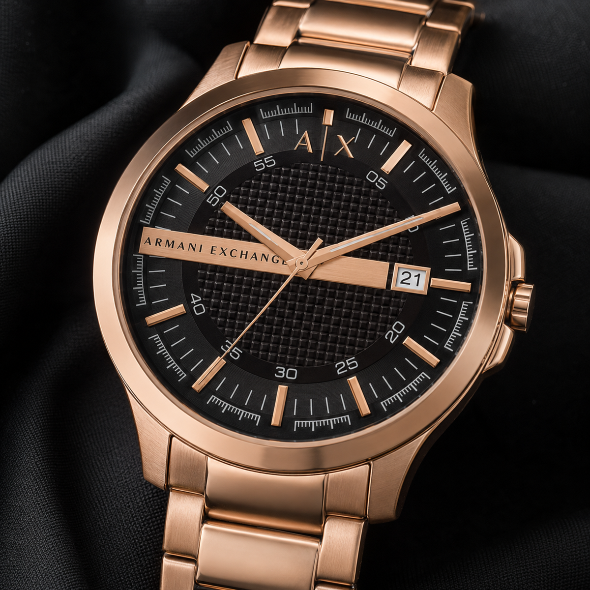 Armani Exchange AX2449 men's rose gold and black watch macro detail