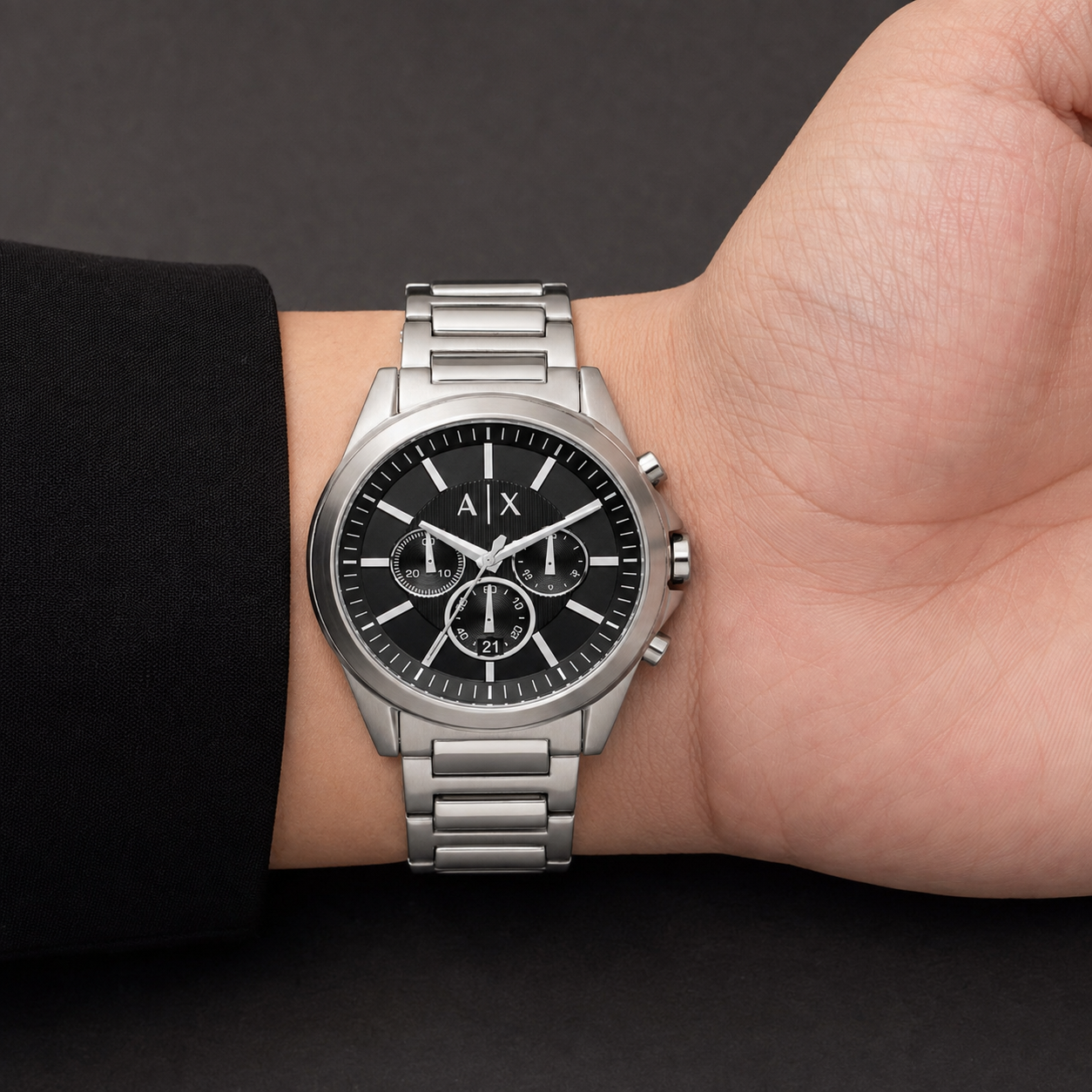 Armani Exchange AX2600 men's silver and black chronograph watch on inner wrist